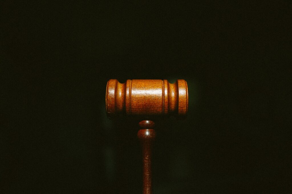 brown wooden stand with black background Powerful ChatGPT Prompts for Lawyers & Legal Research, unlockaiprompts.com